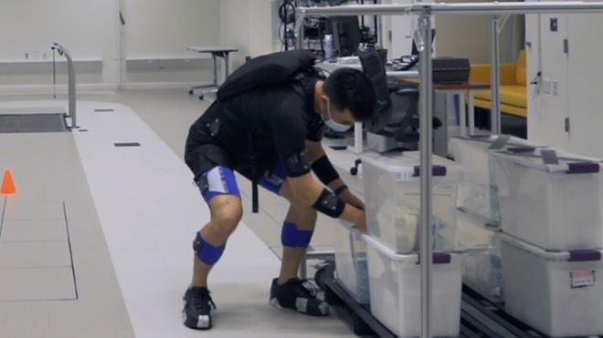 man wearing an exosuit to help with low back pain