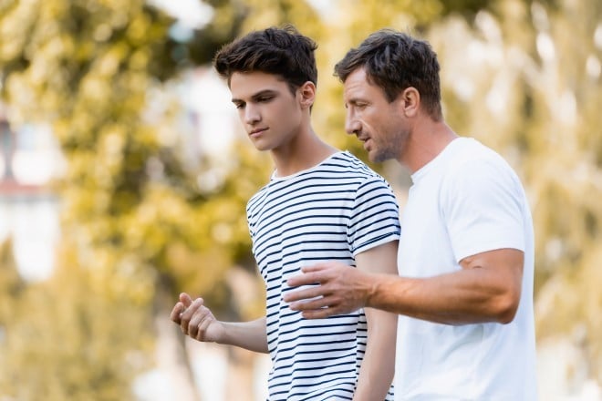 Dad walks and talks with his son