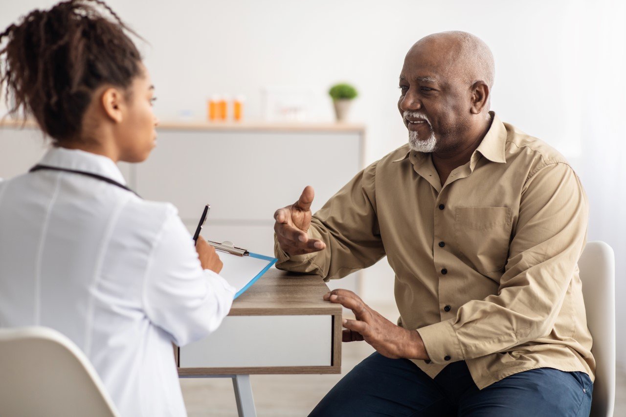 A doctor and patient converse amicably