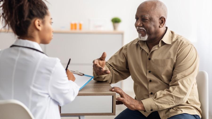 A doctor and patient converse amicably